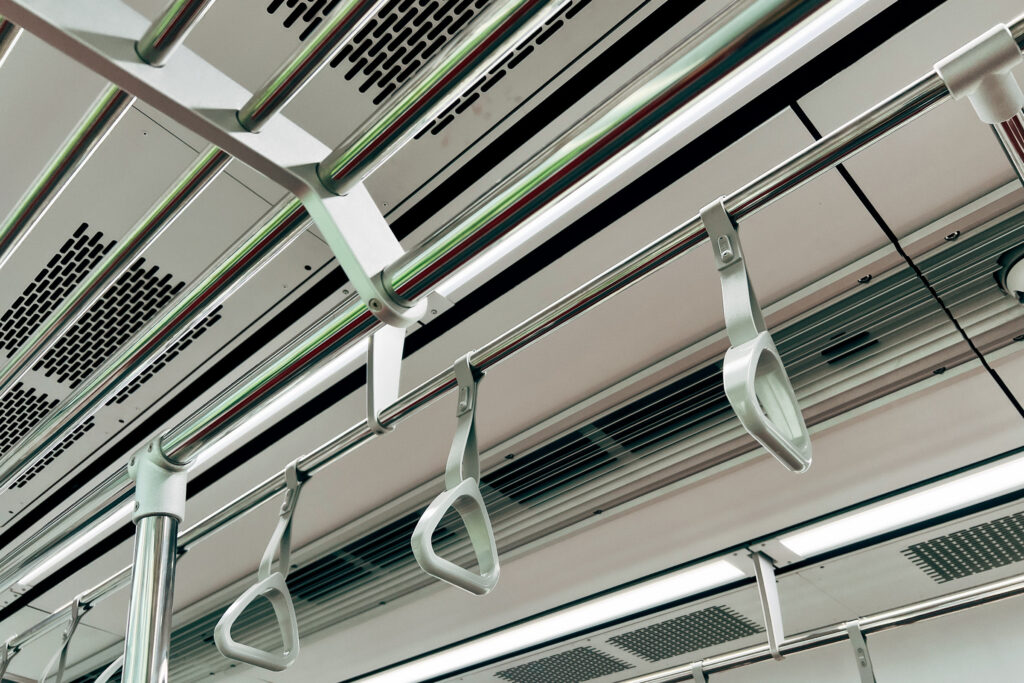 empty handle grip on a subway train, public transportation easily getting infected by covid 19 virus