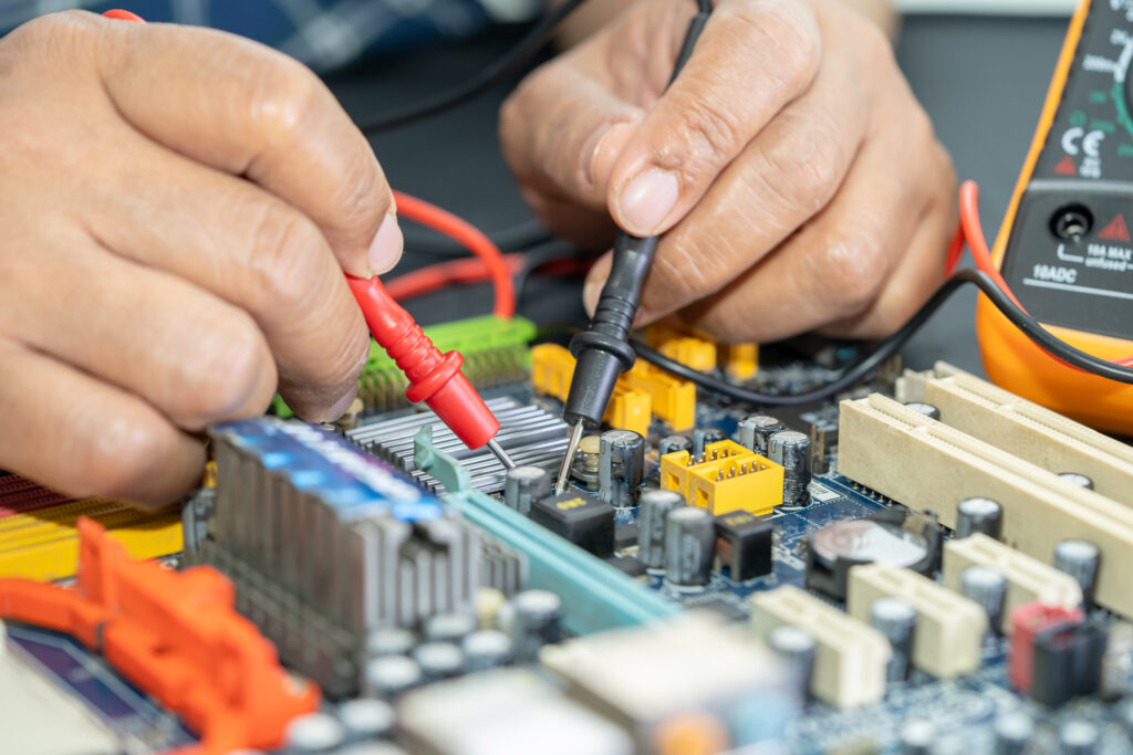 Technician repairing inside of mobile phone by soldering iron. Integrated Circuit. the concept of data, hardware, technology.