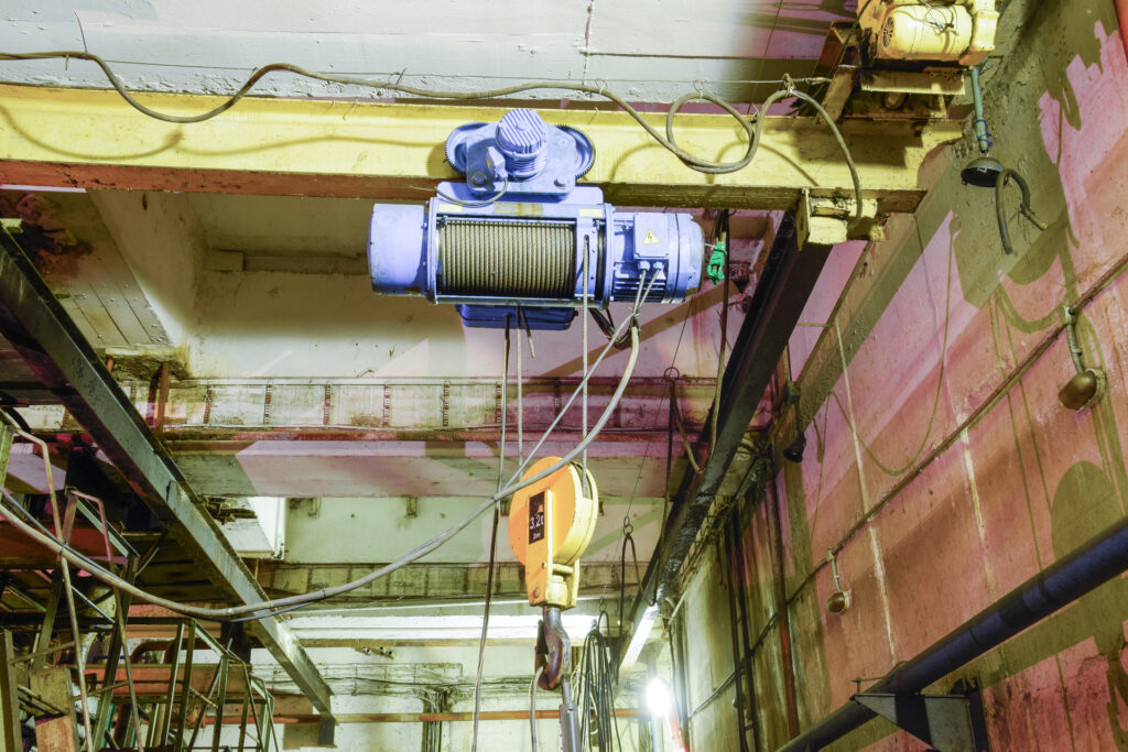 Basement of a water pumping station. Abandoned post-apocalyptic view of the basement pumping rooms.