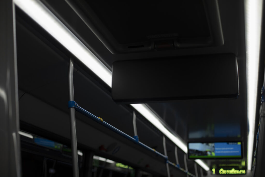 Interior of bus. Night bus. Public transport details. Handrails inside cabin.